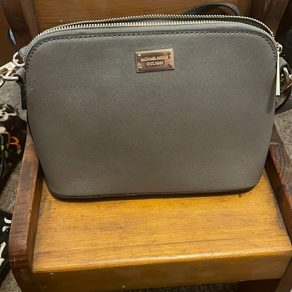 Michael Kors small dome crossbody taupe in color